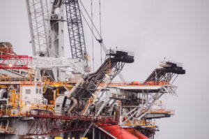 oil-drilling-rig-silhouette-cloudy-sky-300x199
